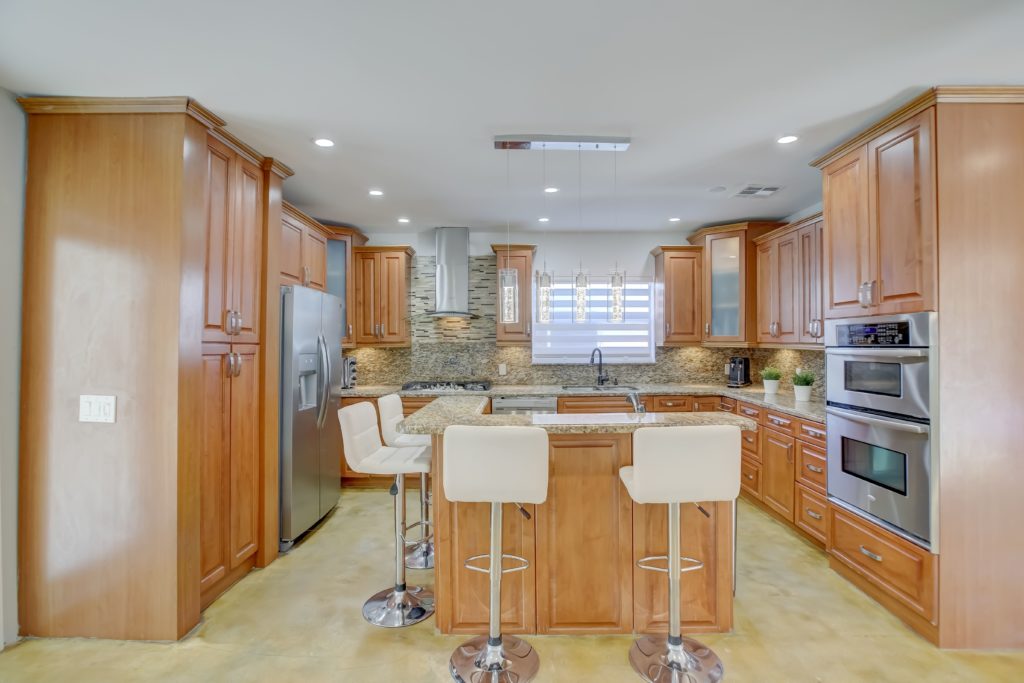 Well-maintained North Palm Beach home for sale, showcasing curb appeal and interior features